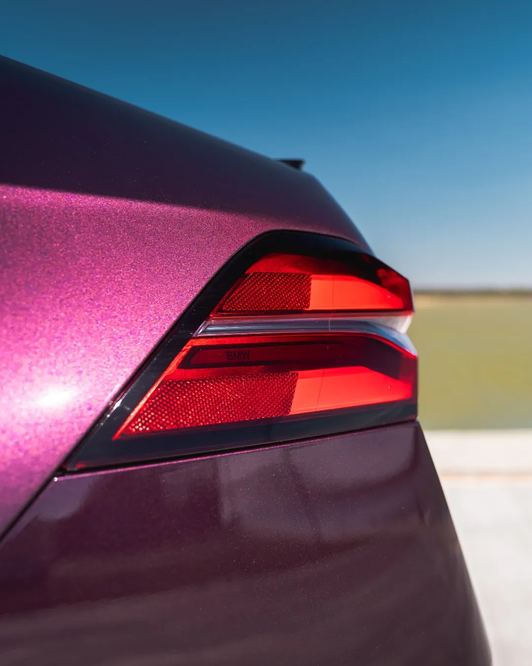 Side profile of the hybrid sedan highlighting elongated proportions, taut character line, and immaculate paint finish
