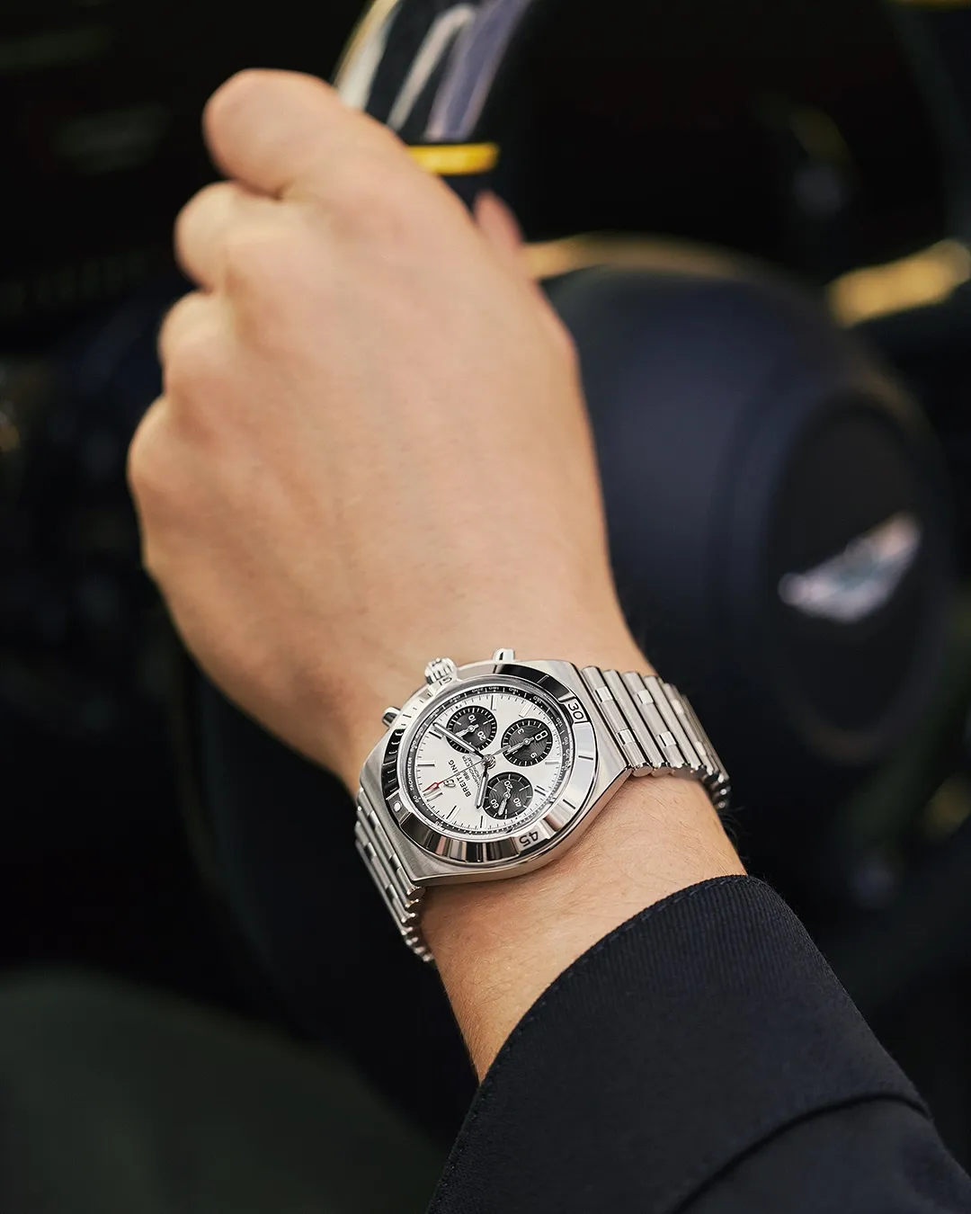 Detailed view of the invisible butterfly clasp mechanism on the redesigned Chronomat's three-row bracelet