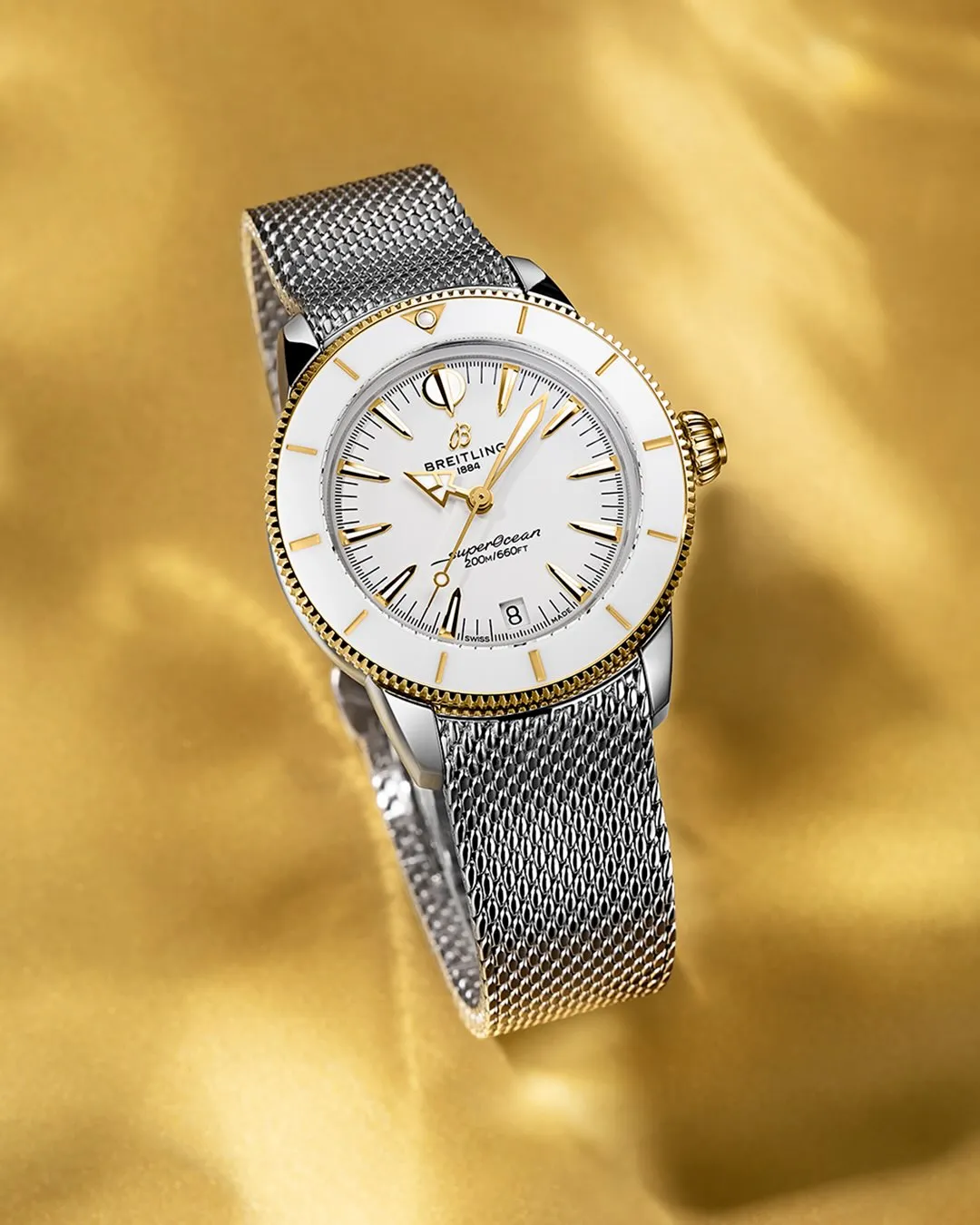 Breitling Superocean Heritage 36 wristwatch featuring yellow gold bezel, crown and dial markers