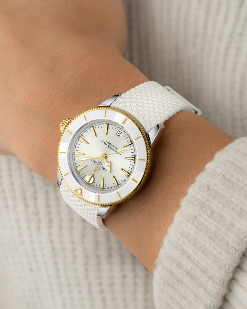 Close-up detail of the Superocean Heritage 36 dial in yellow gold with natural hue finish