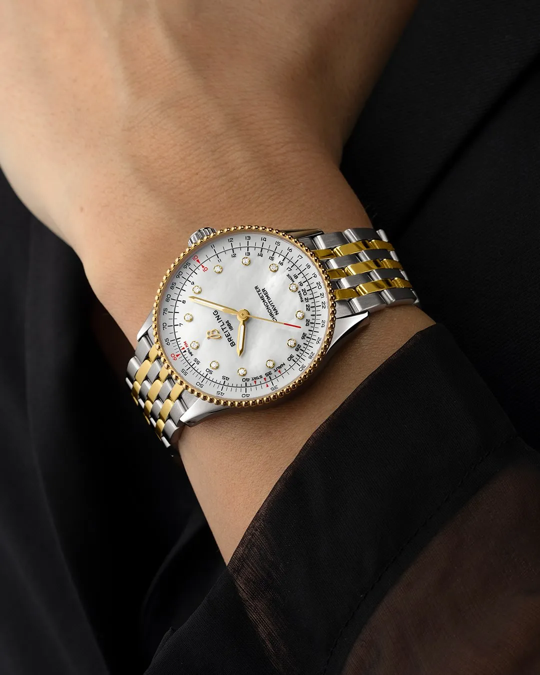 Breitling Navitimer Automatic 36 in two-tone yellow gold and stainless steel with mother of pearl dial and diamond hour markers