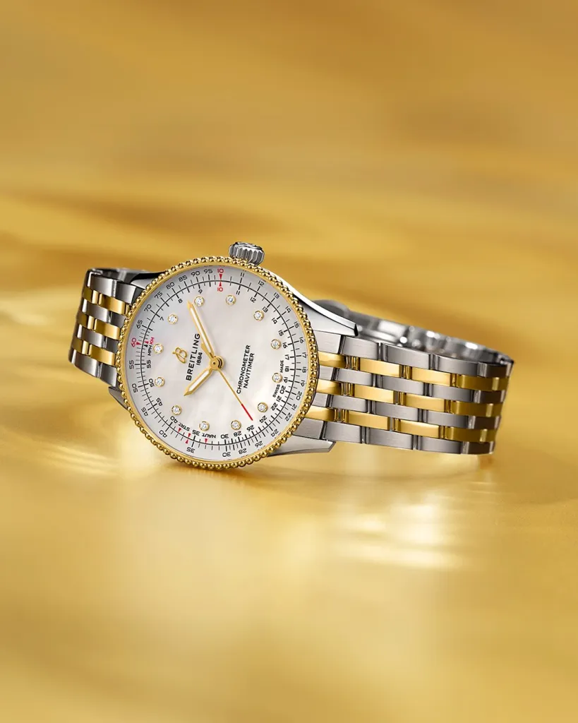 Close-up detail of the Navitimer's signature slide rule bezel and refined dial featuring mother of pearl and diamond markers