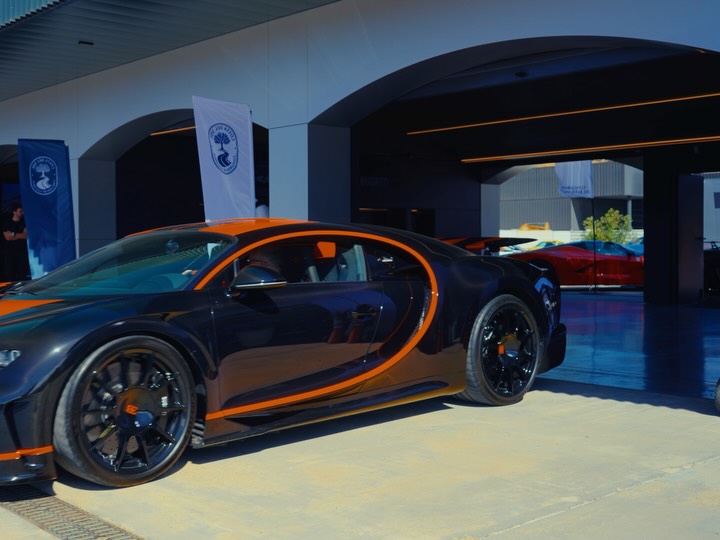 Collection of iconic Bugatti vehicles lined up at the legendary Spanish circuit