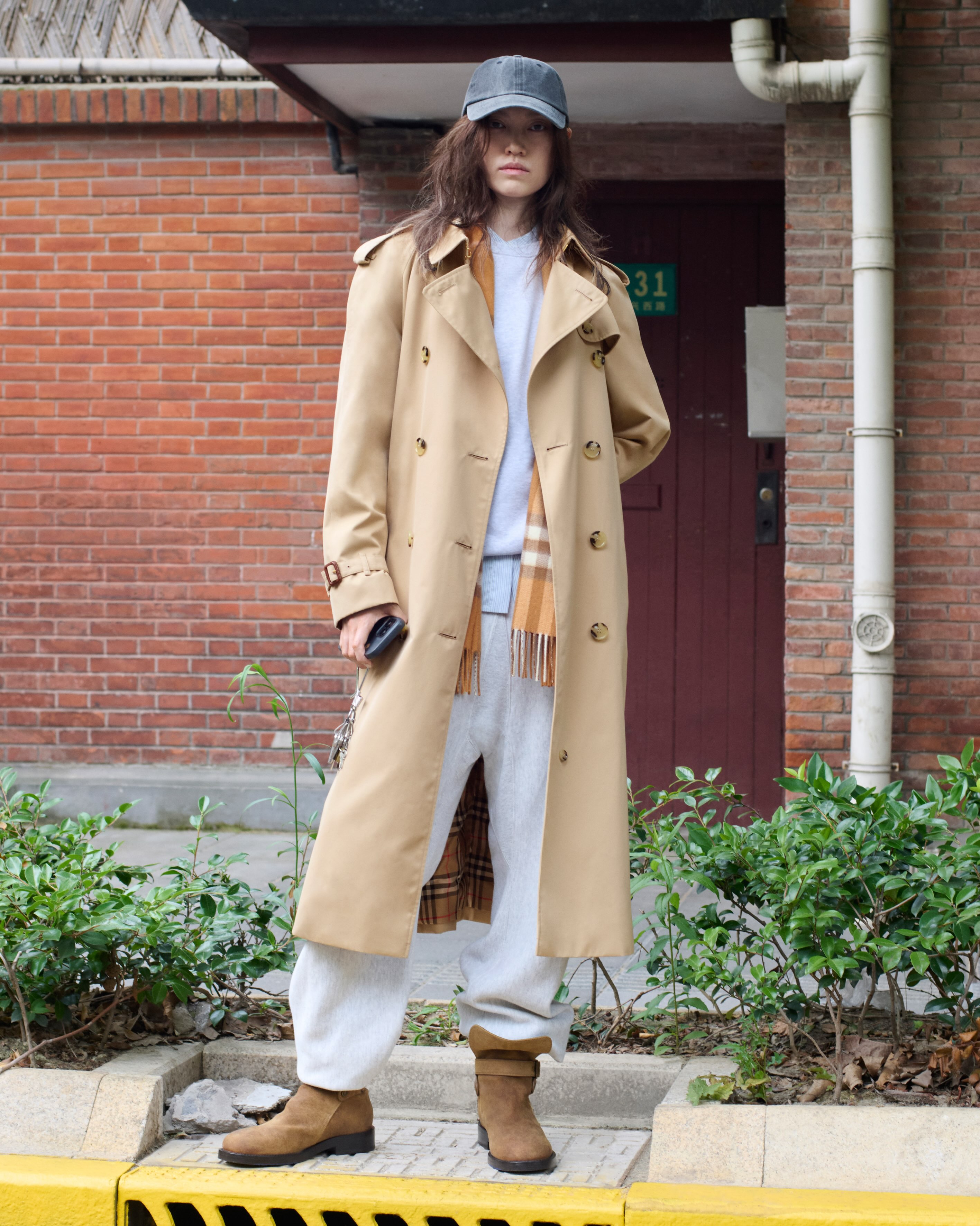 Xiao Xiao styling Burberry trench coat in Shanghai