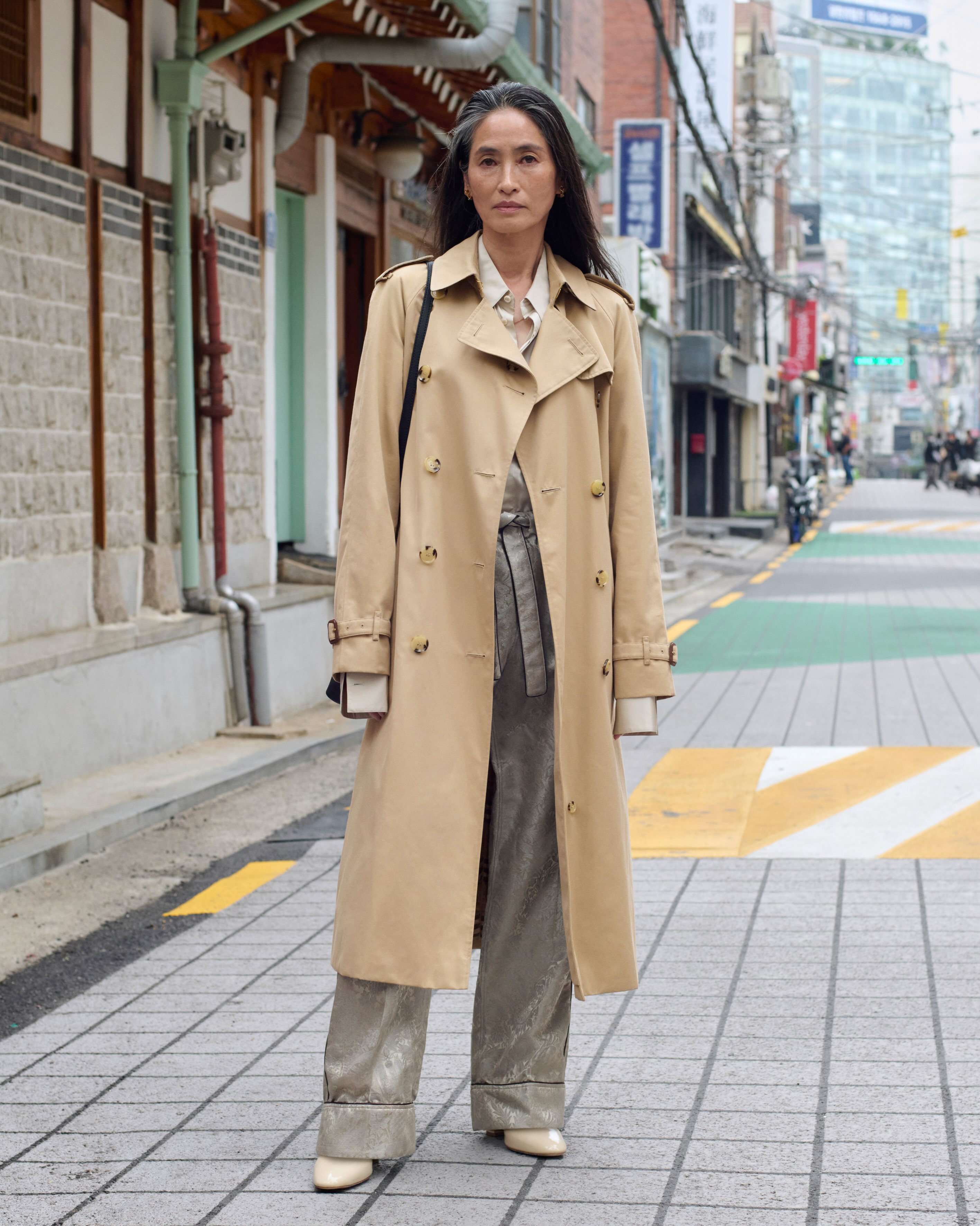 Susan Kim wearing Burberry trench coat in Seoul
