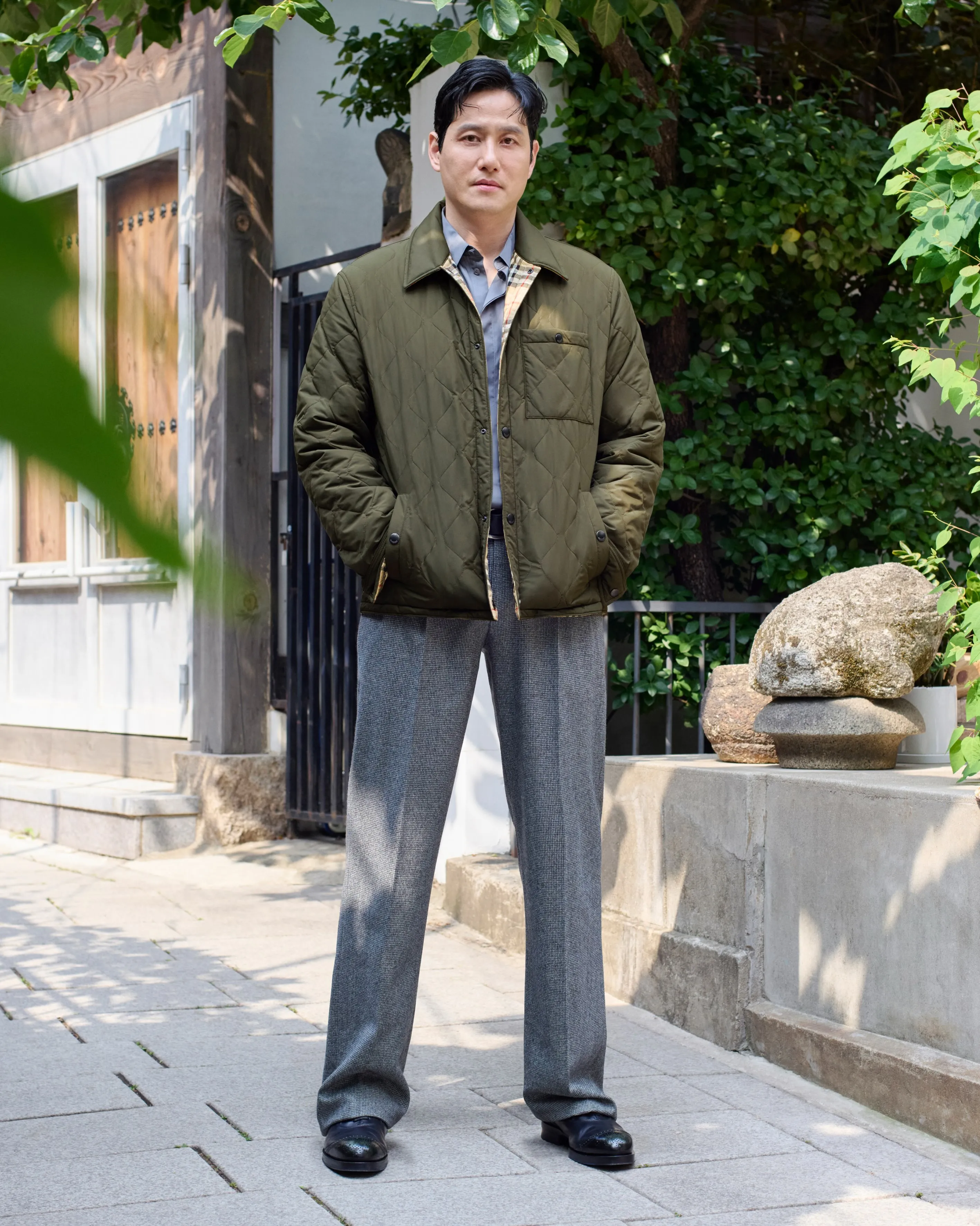 Danny Blake in Burberry's refined puffer in London, embodying quiet confidence and understated elegance