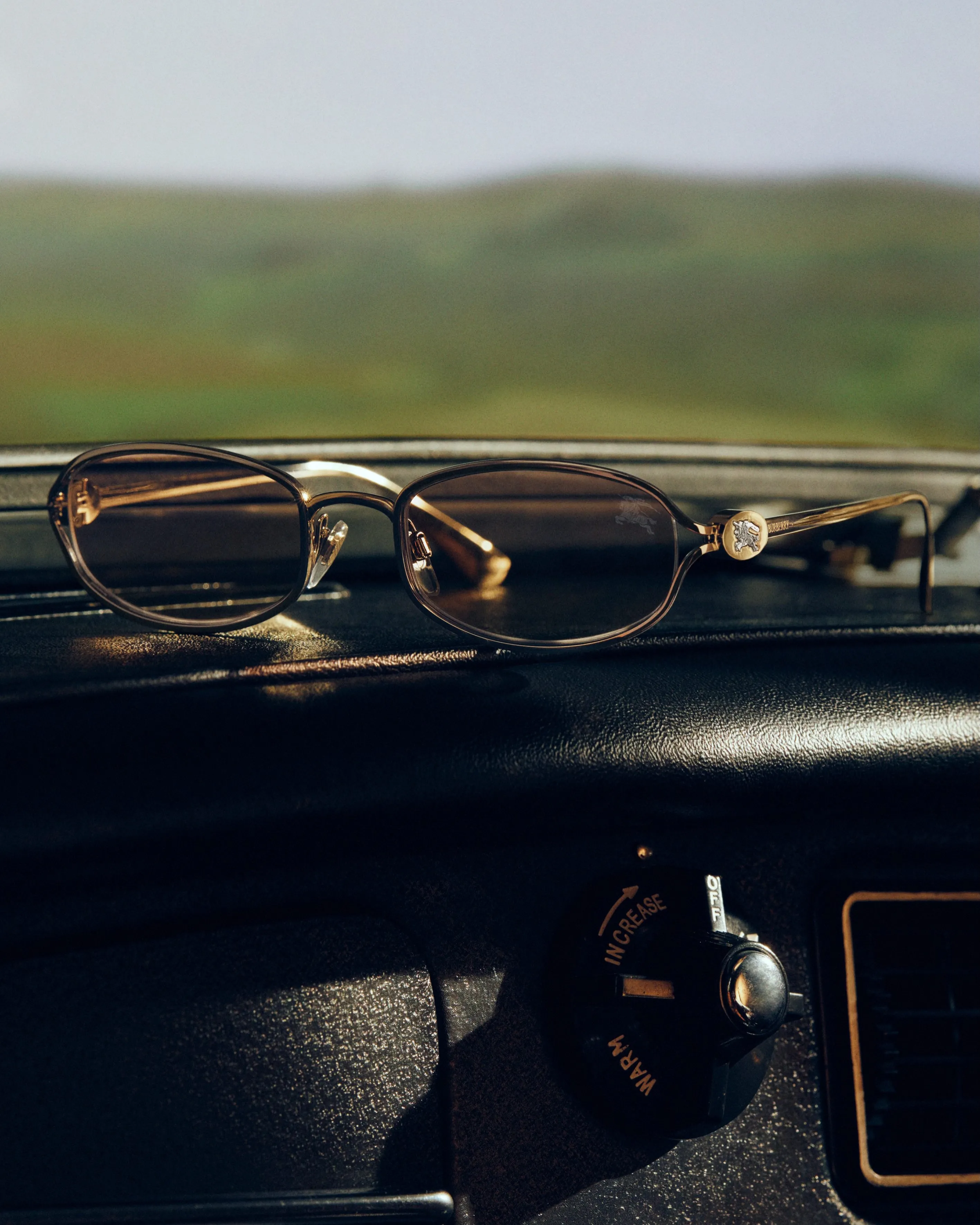 Model wearing Burberry optical frames in a contemplative moment, showcasing frame proportions