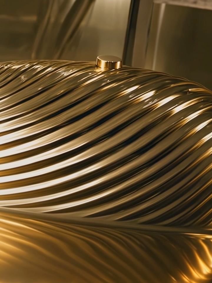Close-up of the Melone's sculptural form, highlighting the meticulous hand-finishing and metalwork craftsmanship