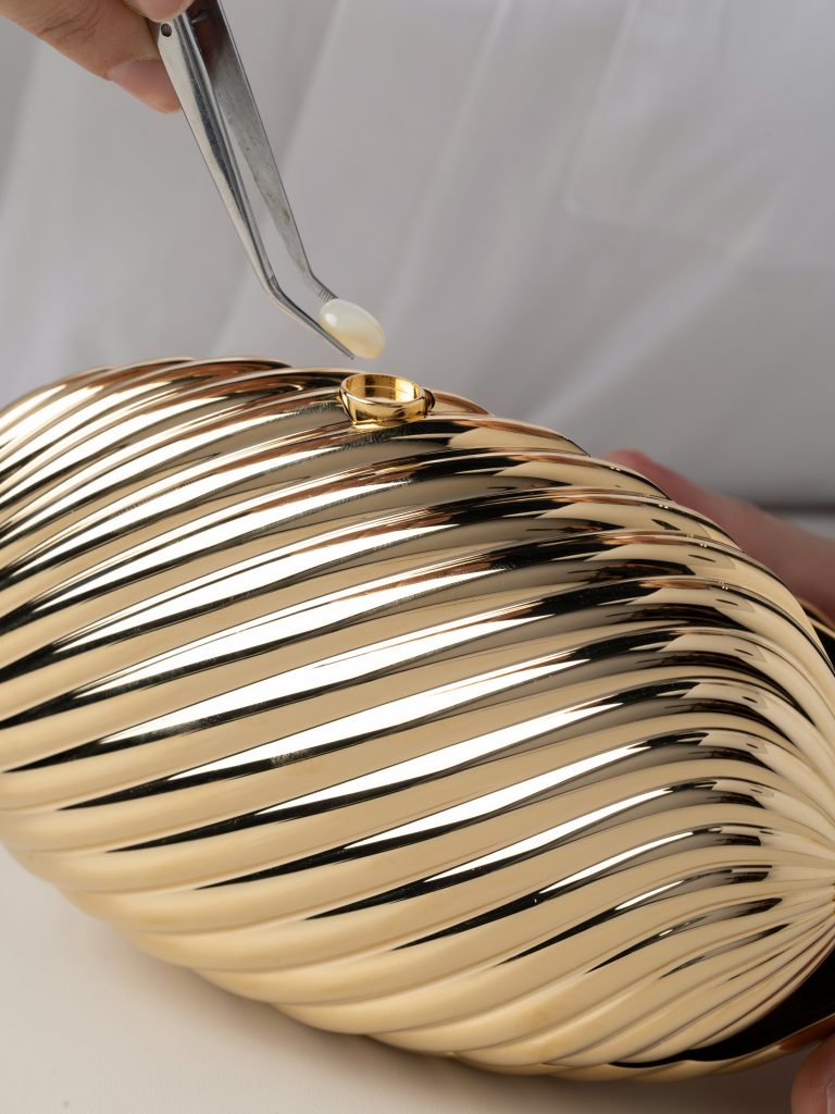 Detail of the black tassel and metal attachment, demonstrating the considered finishing touches