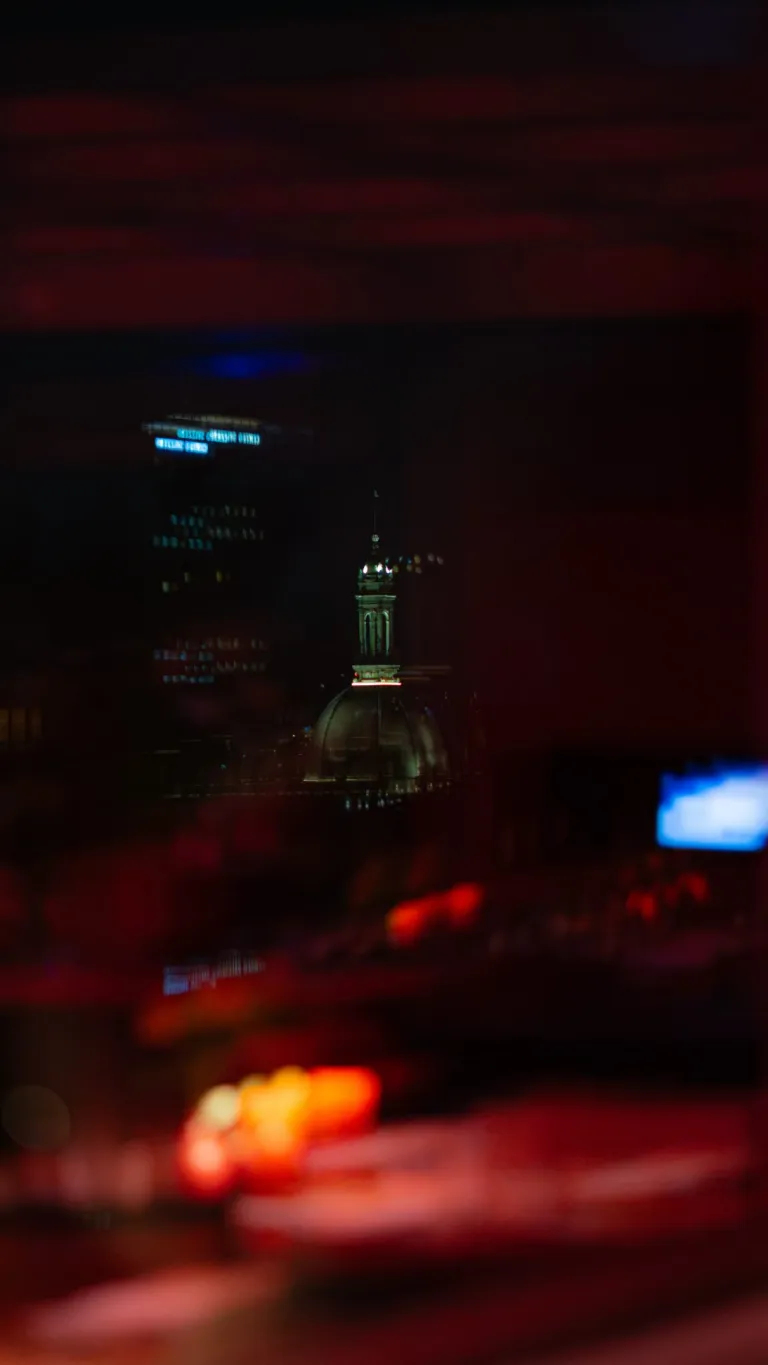 Casa Brera's Etereo rooftop bar during Milan Mixology Week, showcasing expert bartenders crafting cocktails above Milan's illuminated cityscape
