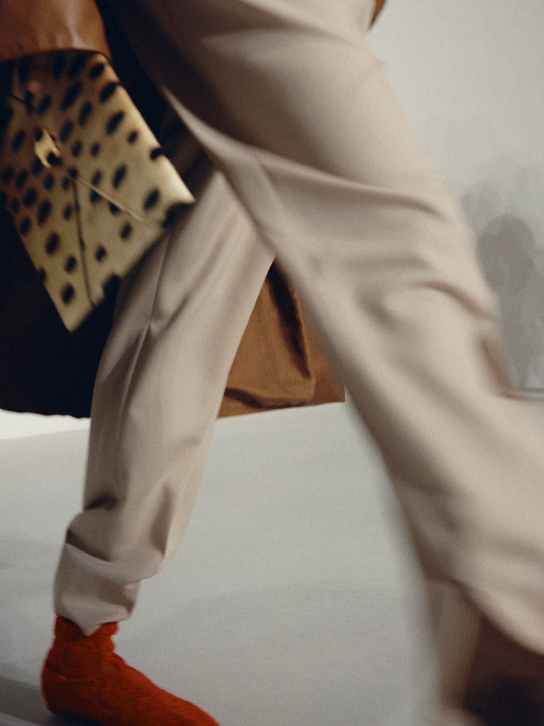 Neutral toned outfit showcasing the collection's commitment to subtle sophistication