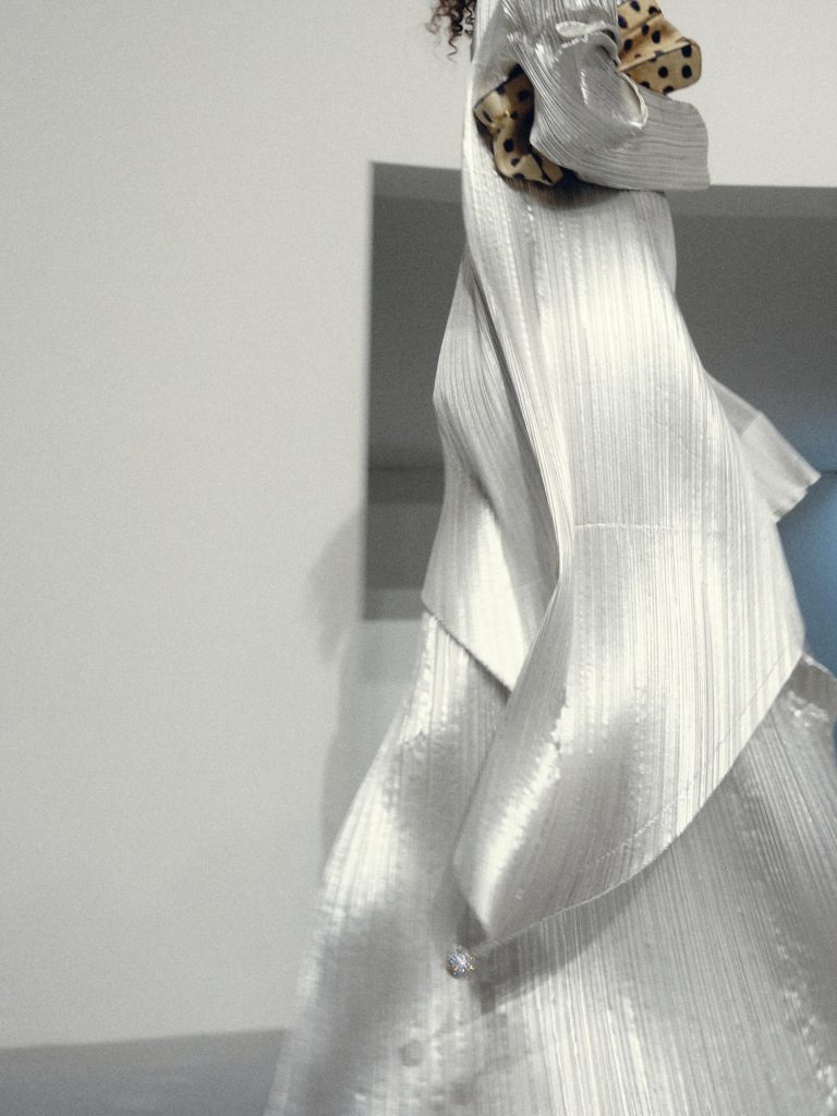 Architectural detail of structured cream jacket silhouette