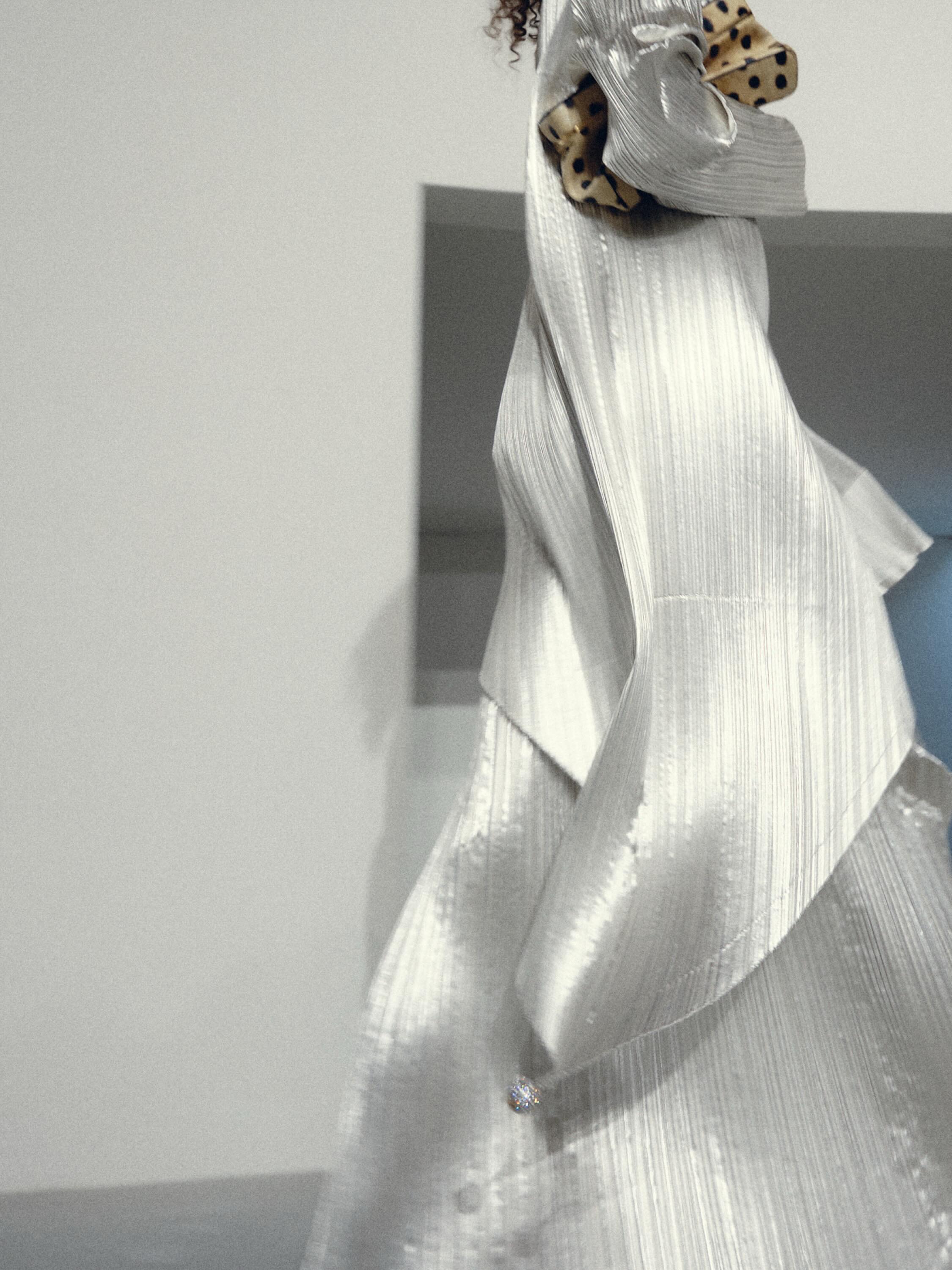 Architectural detail of structured cream jacket silhouette