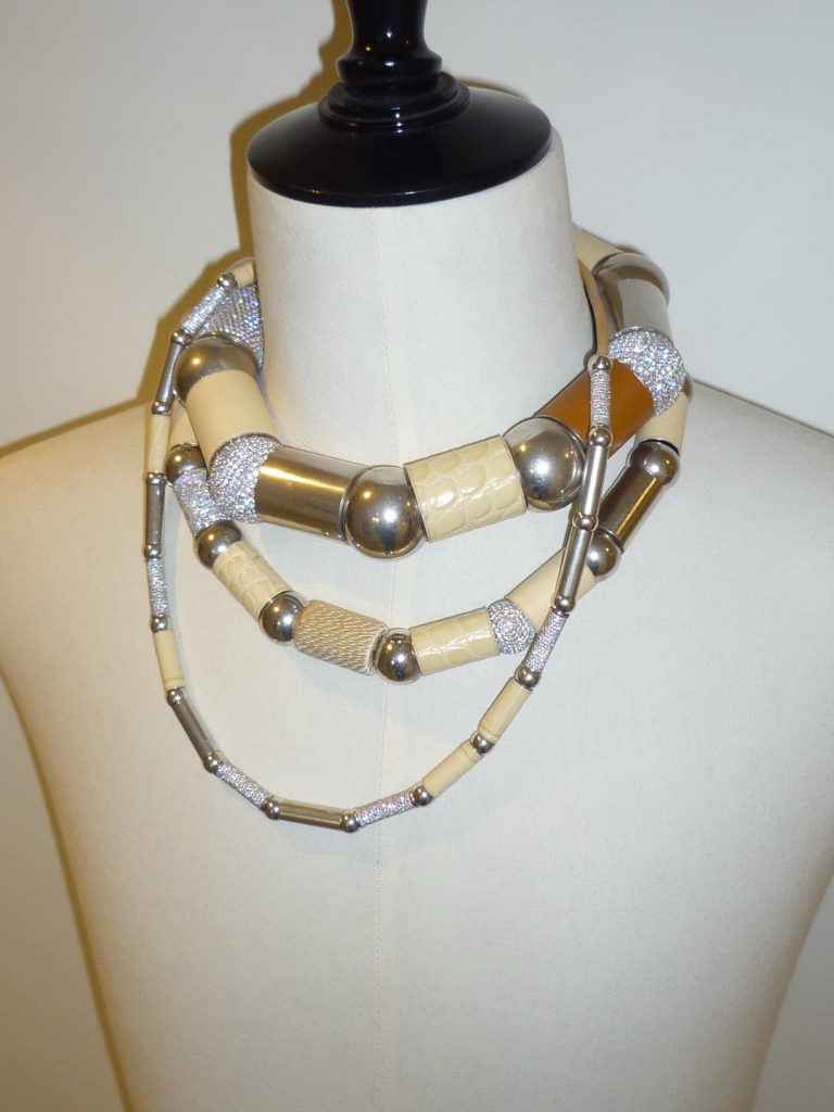 Two-tone neutral dress with subtle tonal contrast and elegant proportions