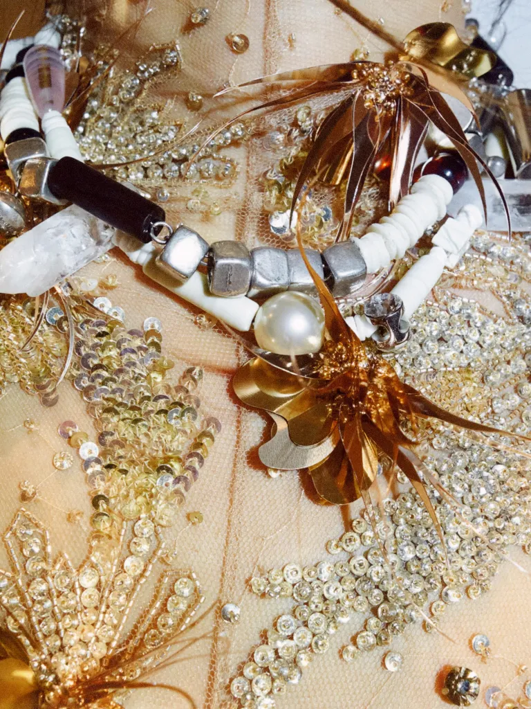 Detail of delicate pleating on ethereal white summer dress