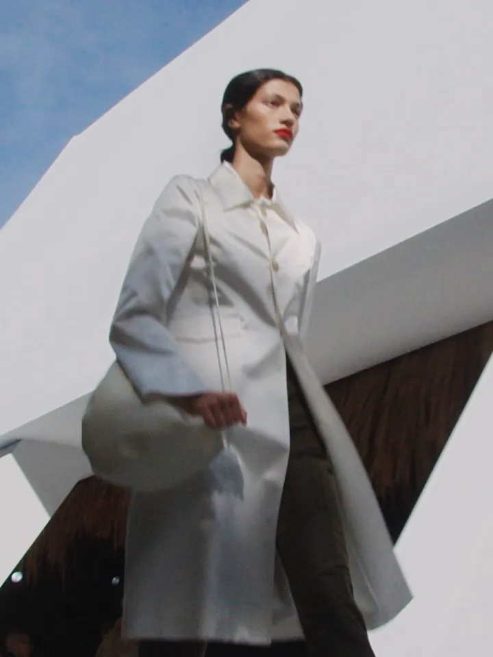 Model wearing effortless linen ensemble in muted palette