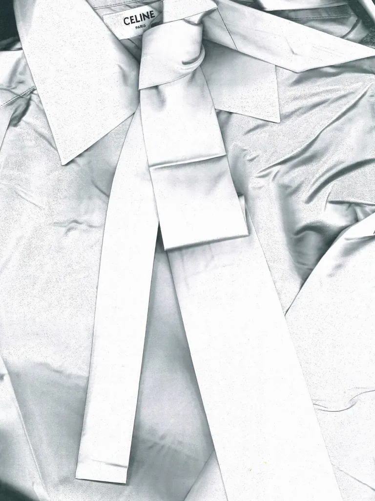 Side profile showcasing graceful fabric movement and proportion
