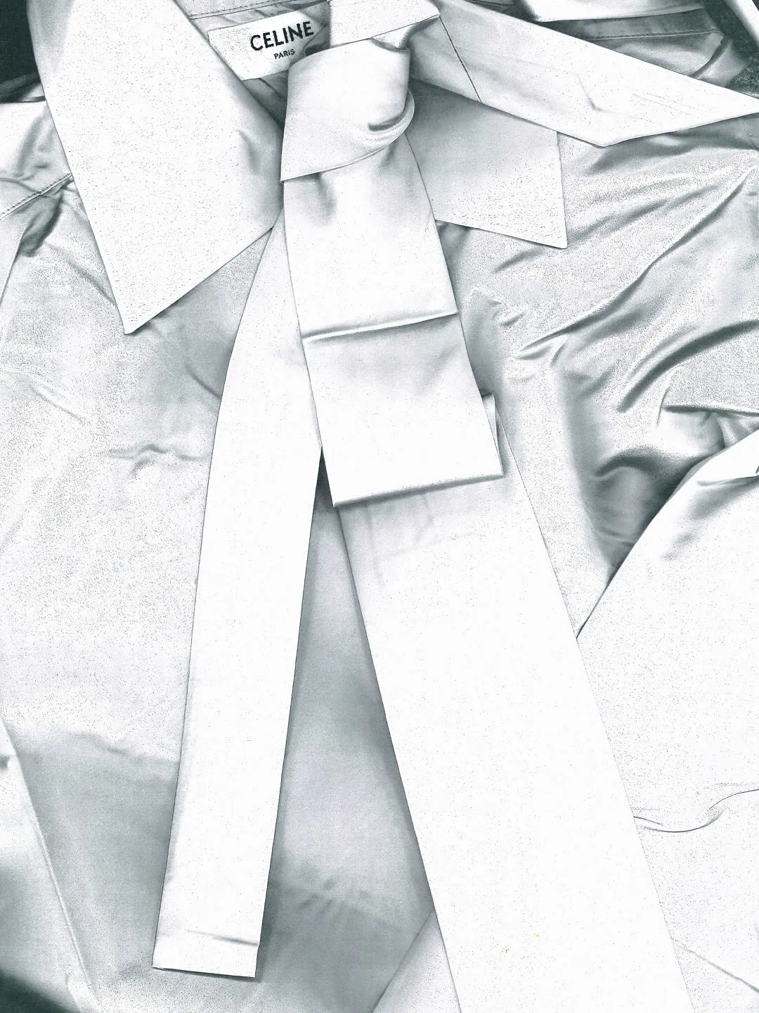 Side profile showcasing graceful fabric movement and proportion