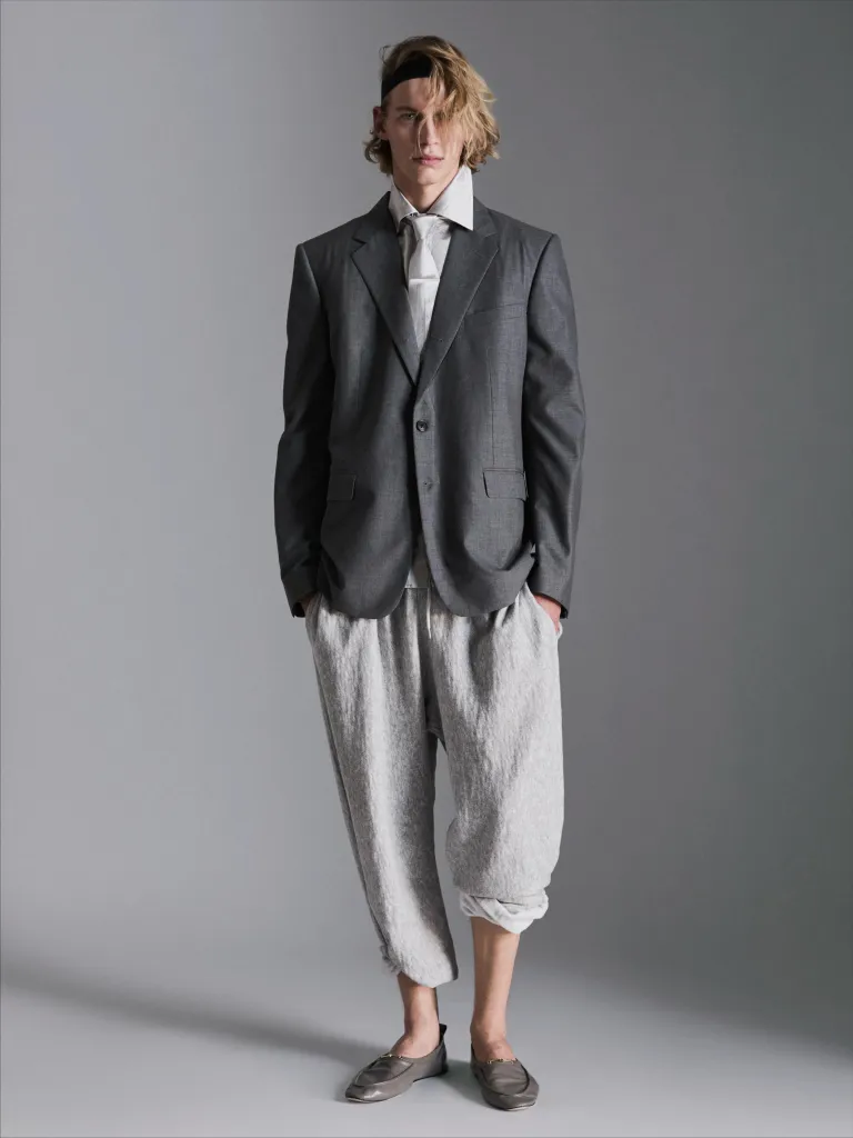 Model in minimalist linen ensemble with refined draping