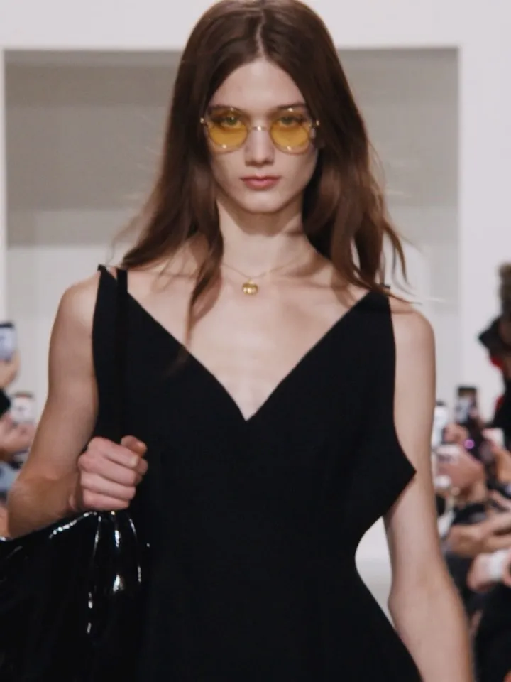 Detail of supple leather accents against weightless chiffon