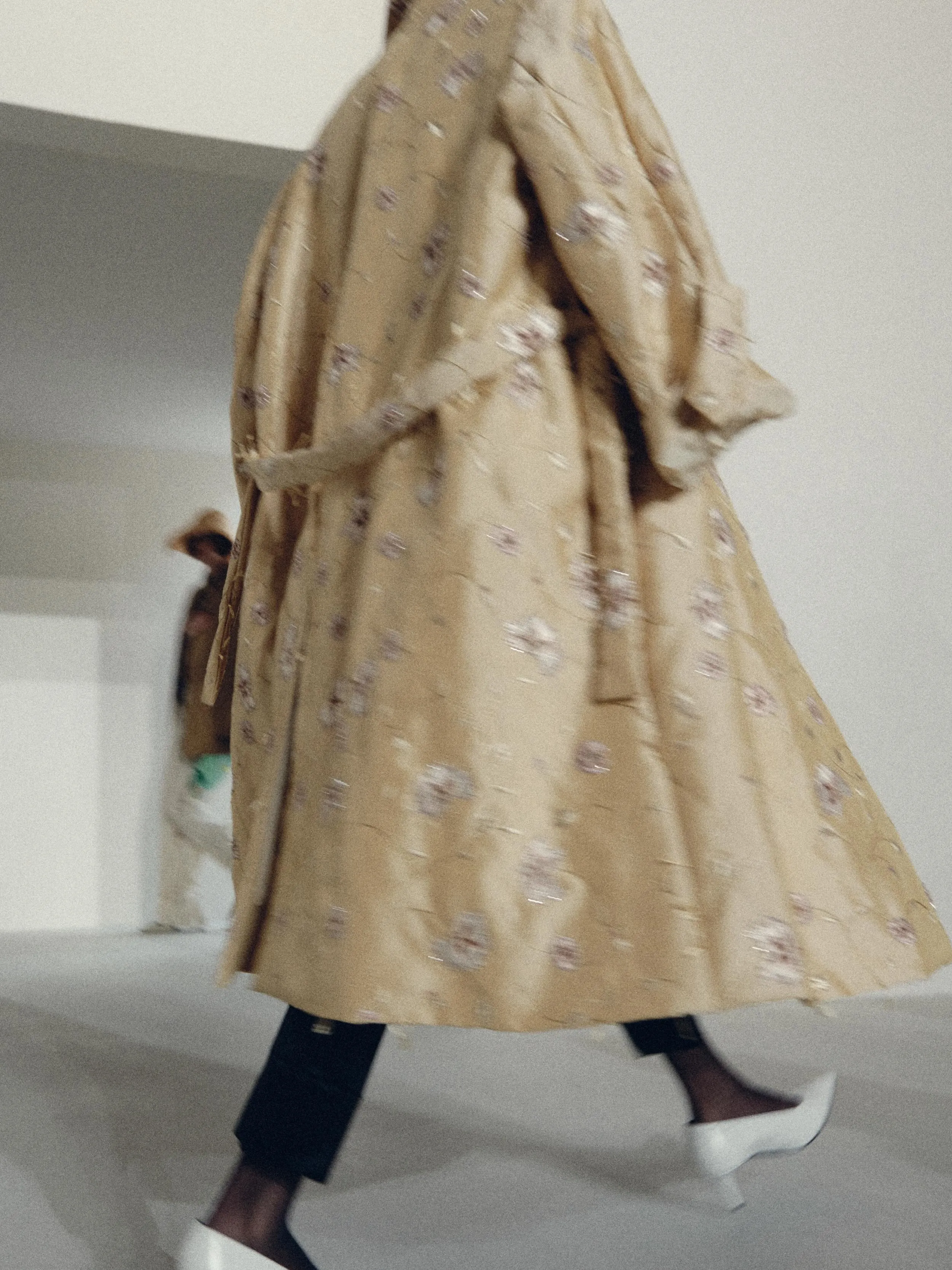 Model wearing effortlessly elegant wide-leg trousers and flowing top