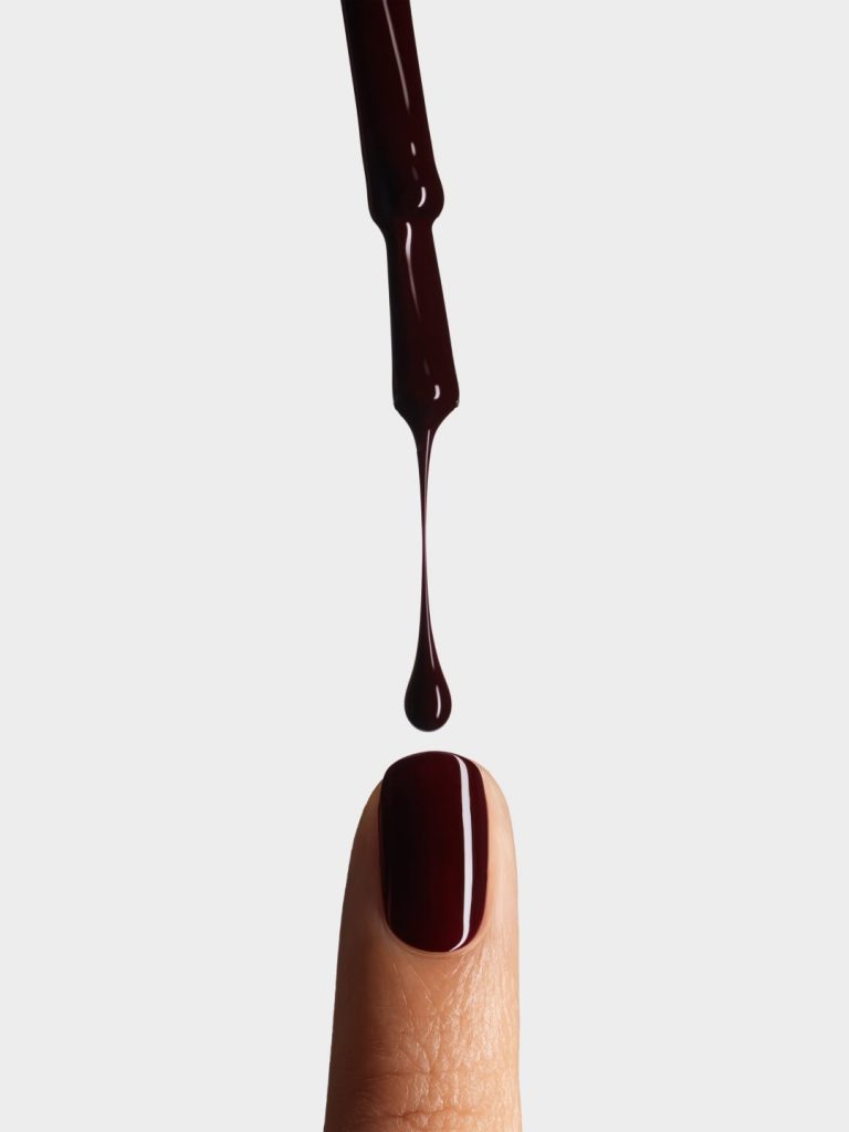 A close-up of Rouge Noir lipstick applied to lips, showcasing the rich, sophisticated depth of the cult iconic colour