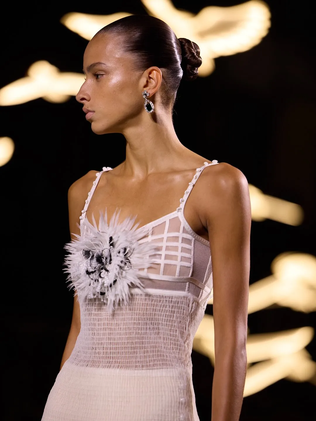 Chanel pencil-skirt suit silhouette reimagined for modern movement and fluidity