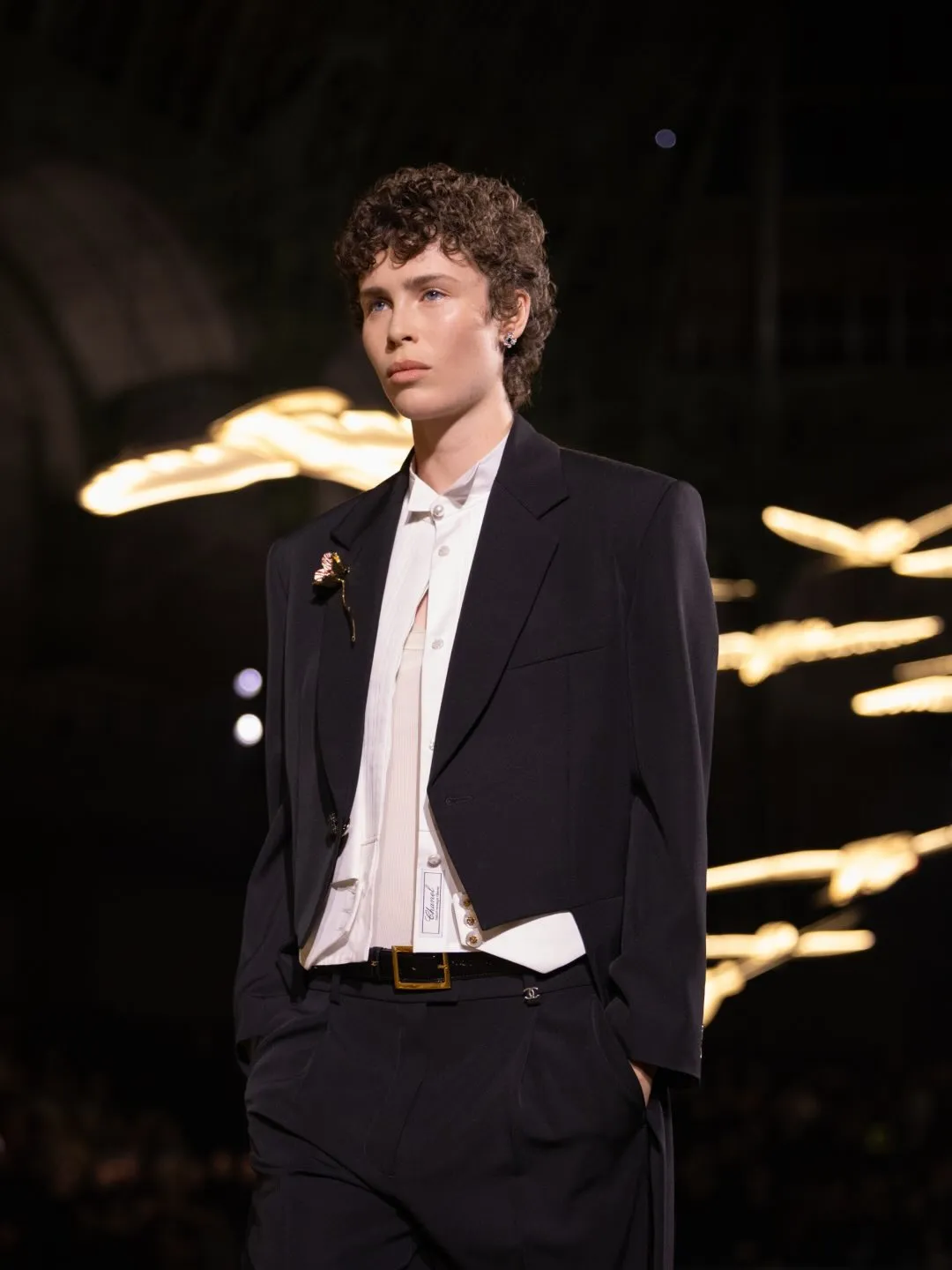 Full-length view of structured tailored ensemble in neutral tones