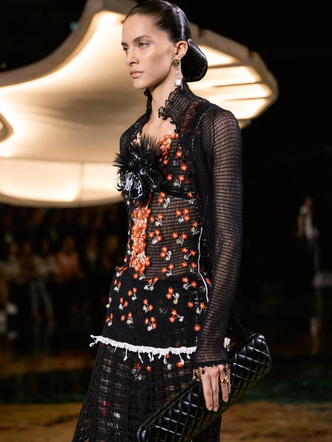 Fabric swatch showing the delicate interplay between opaque and sheer materials with embroidered detailing