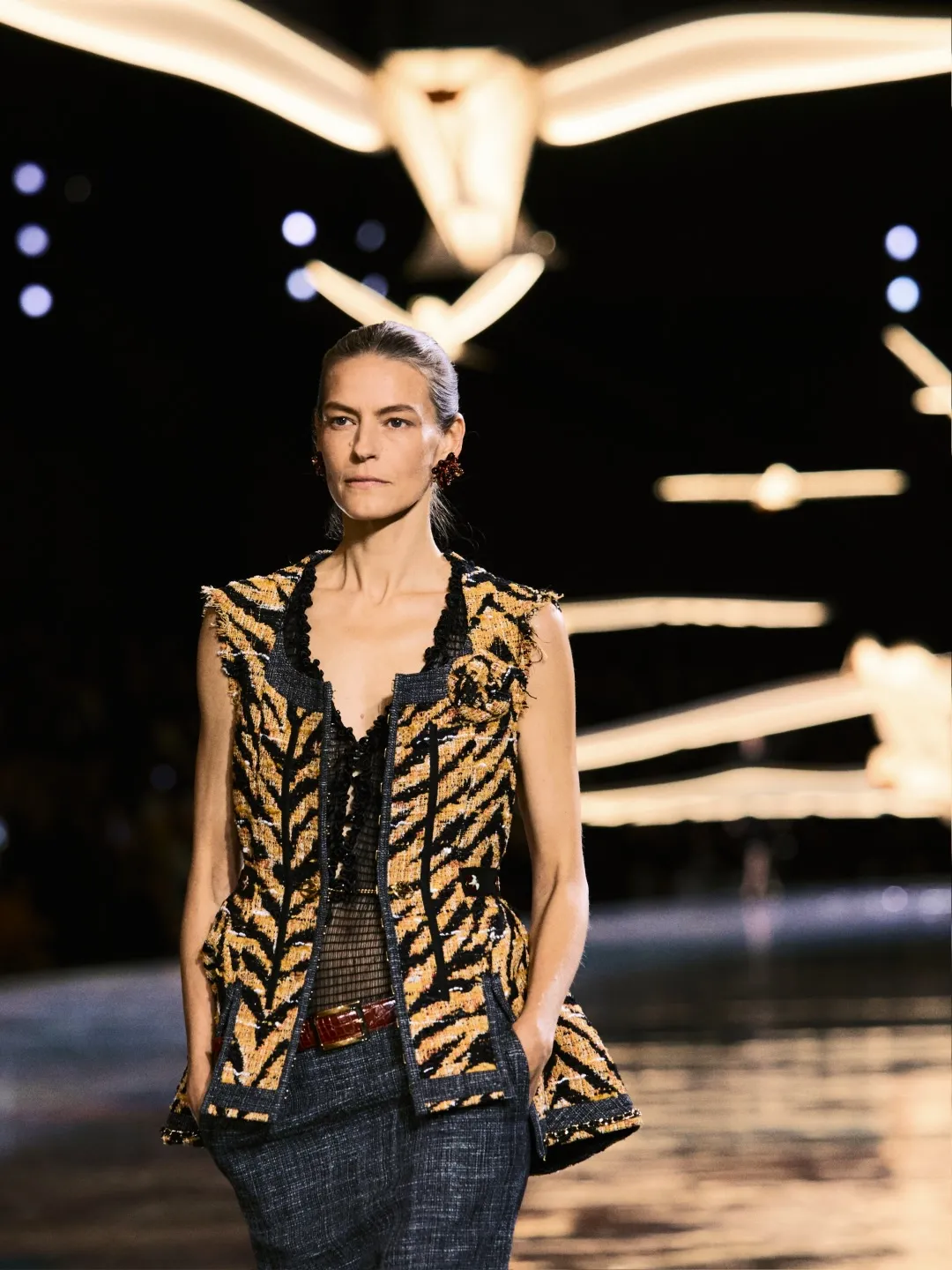 Model in a Chanel knitted silhouette featuring bold colour blocking and animal print inspired by Édouard Vuillard's palette