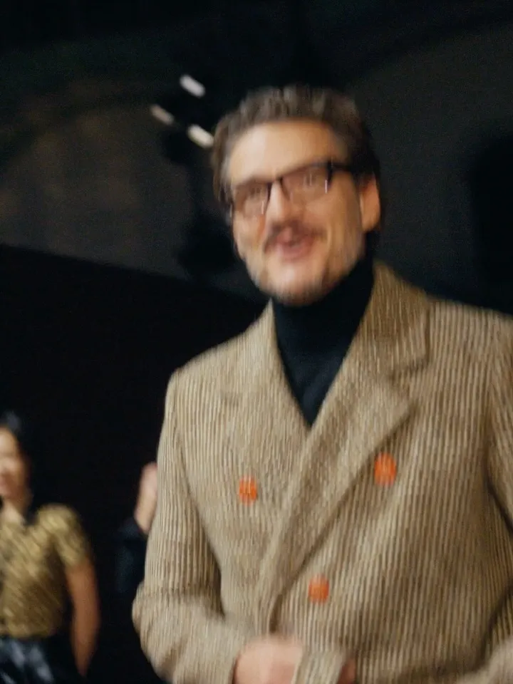 Soft ivory tweed suit with understated elegance on the runway