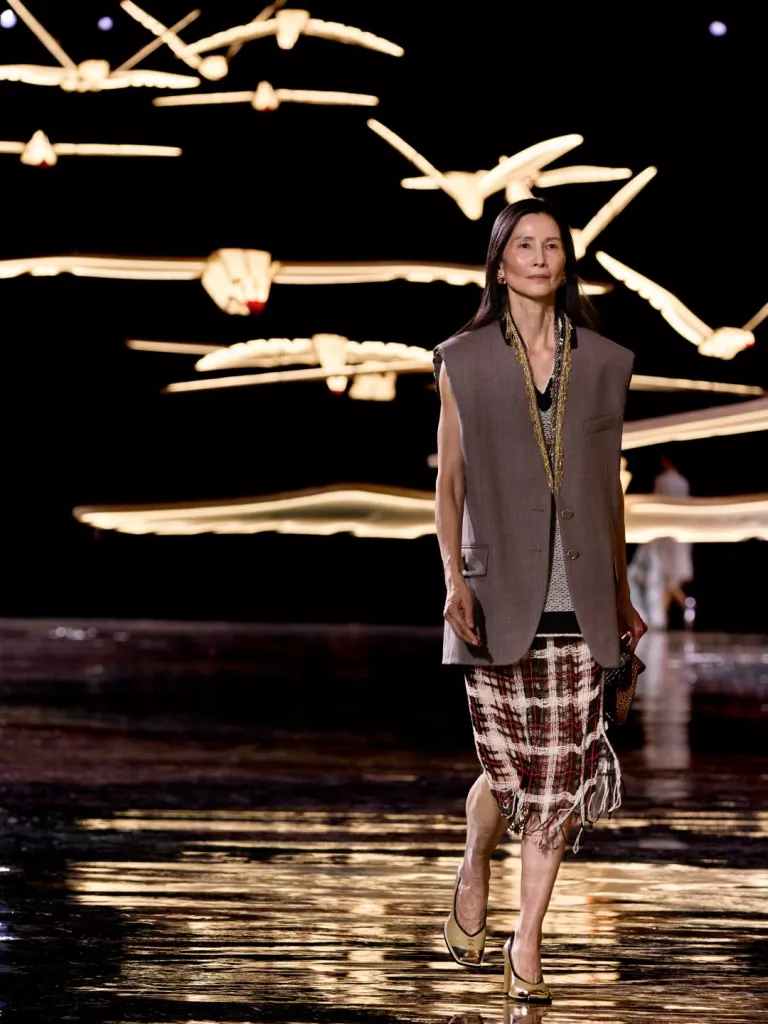 Fluid beaded dress in luminous tones exemplifying CHANEL's contemporary approach to embellishment