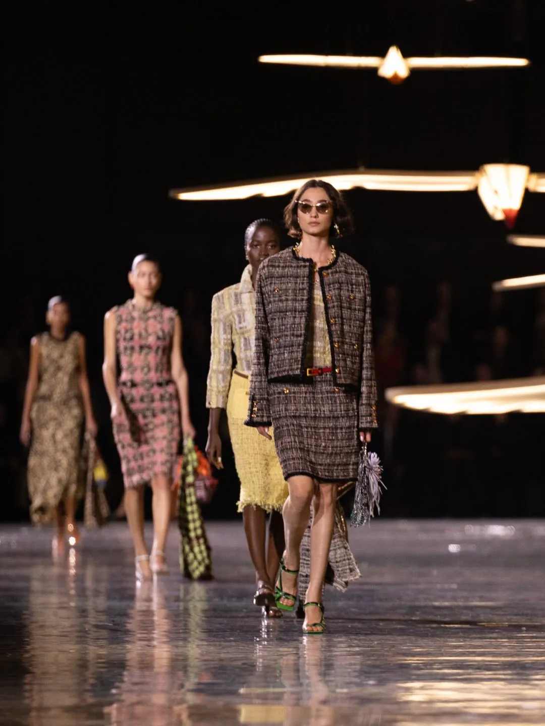 Innovative smocked tweed dress demonstrating movement and fluidity in tailored silhouette