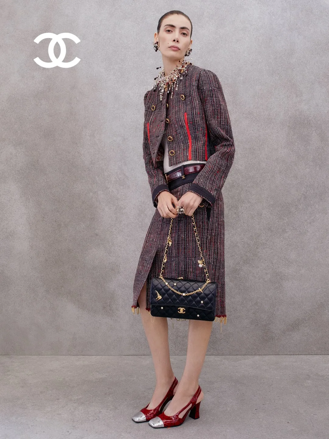 Model in an asymmetrical cut bias dress with lustrous finish