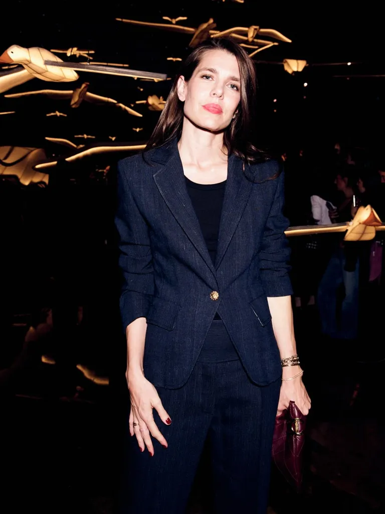 Front row attendee in sophisticated styling