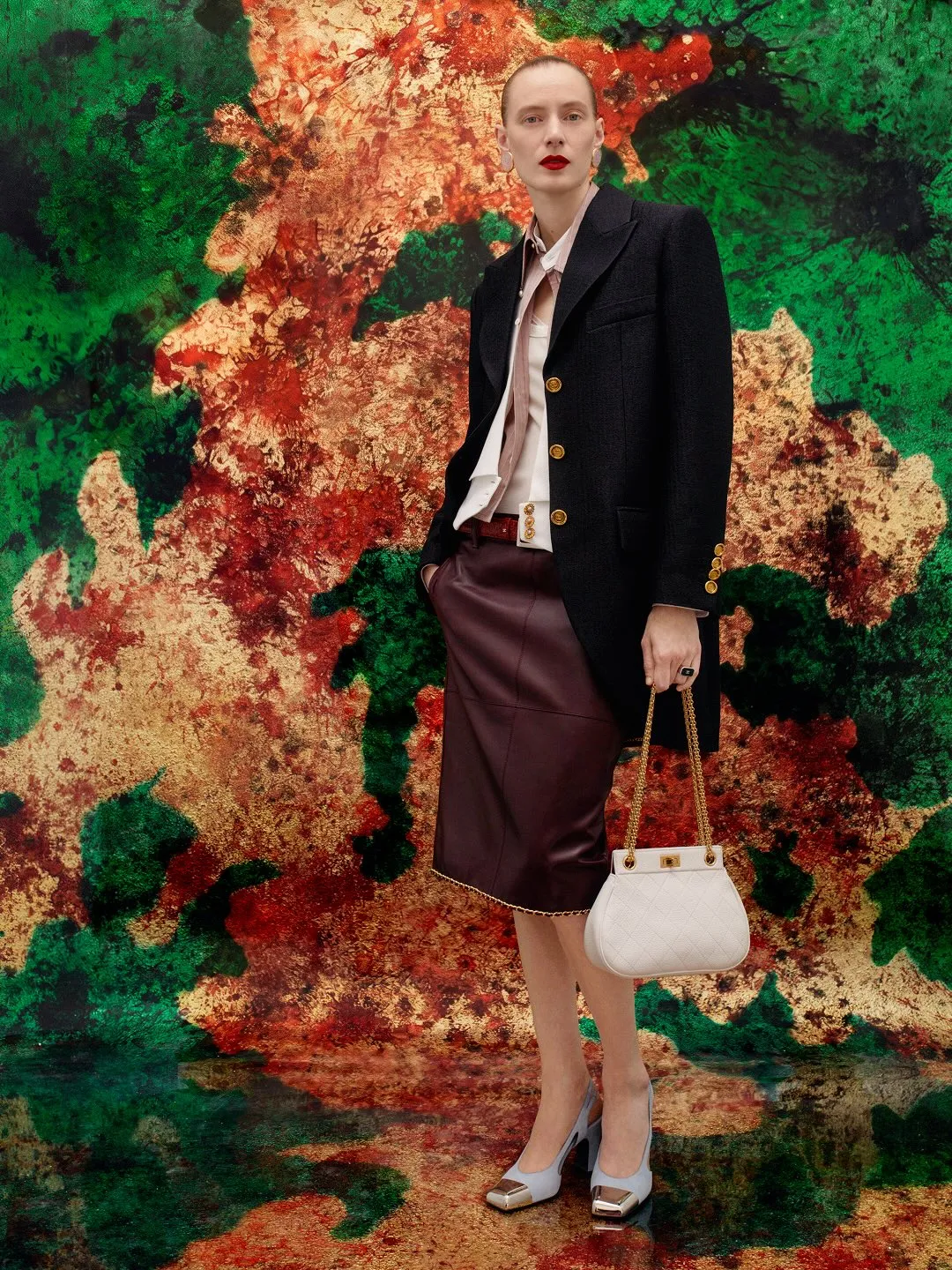 Model wearing minimalist Chanel silhouette with subtle layering from SS27 collection