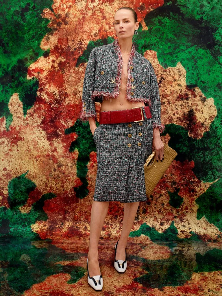 Structured coat dress with sculptural silhouette and perfectly proportioned peplum detail