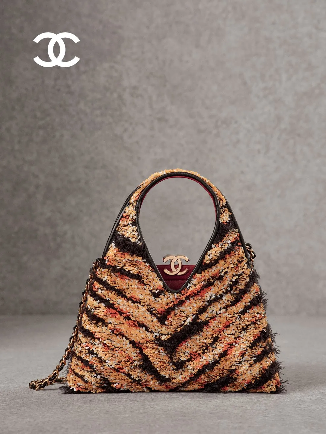 Detail shot of quilted leather handbag with signature interlocking CC hardware