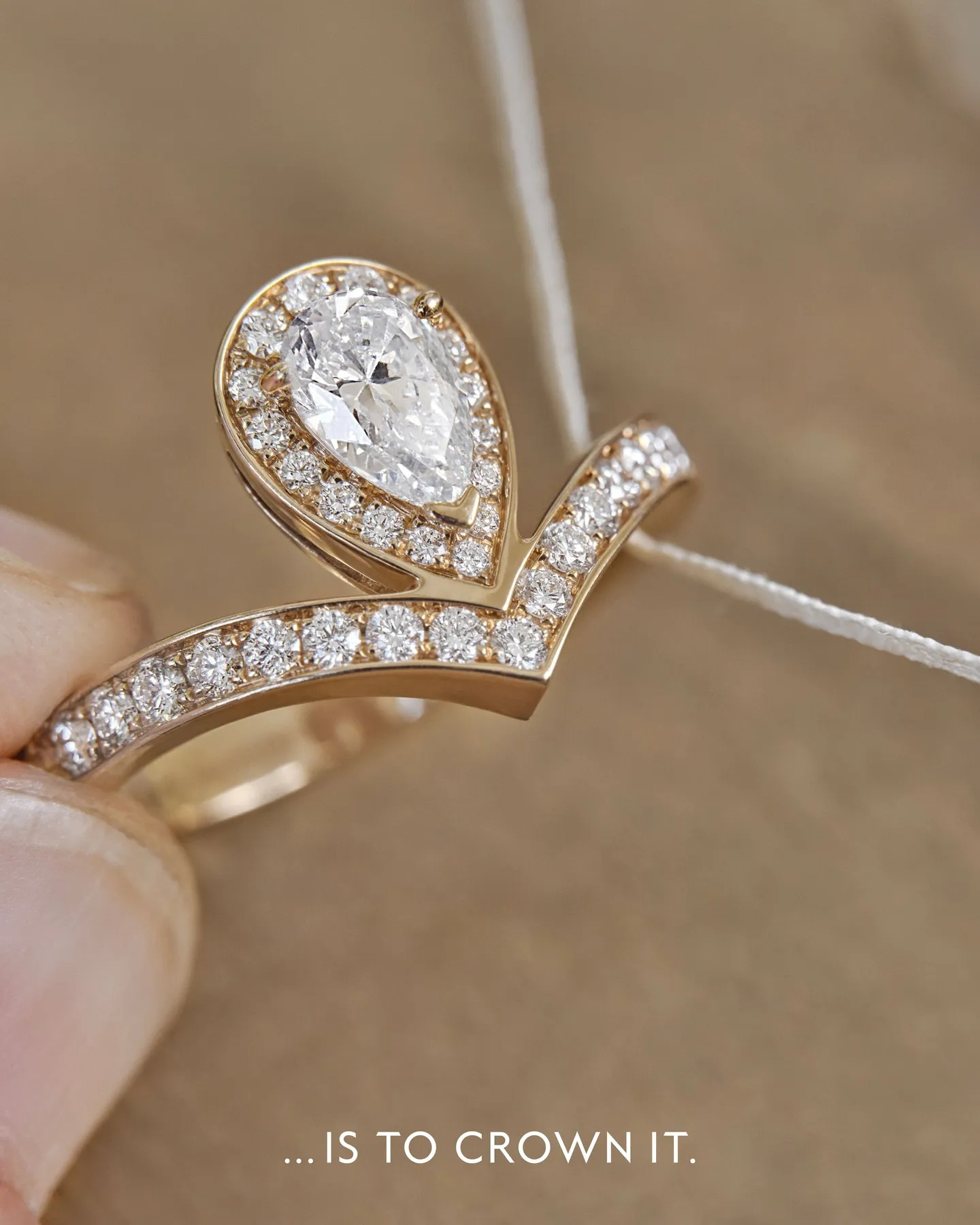 The rose gold setting revealing the minimalist craftsmanship and precise metalwork of the pendant