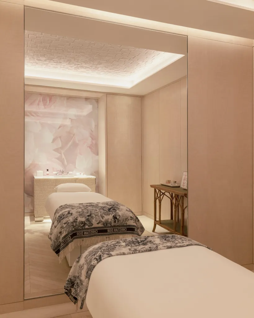 An intimate spa treatment room featuring elegant design and soft natural lighting