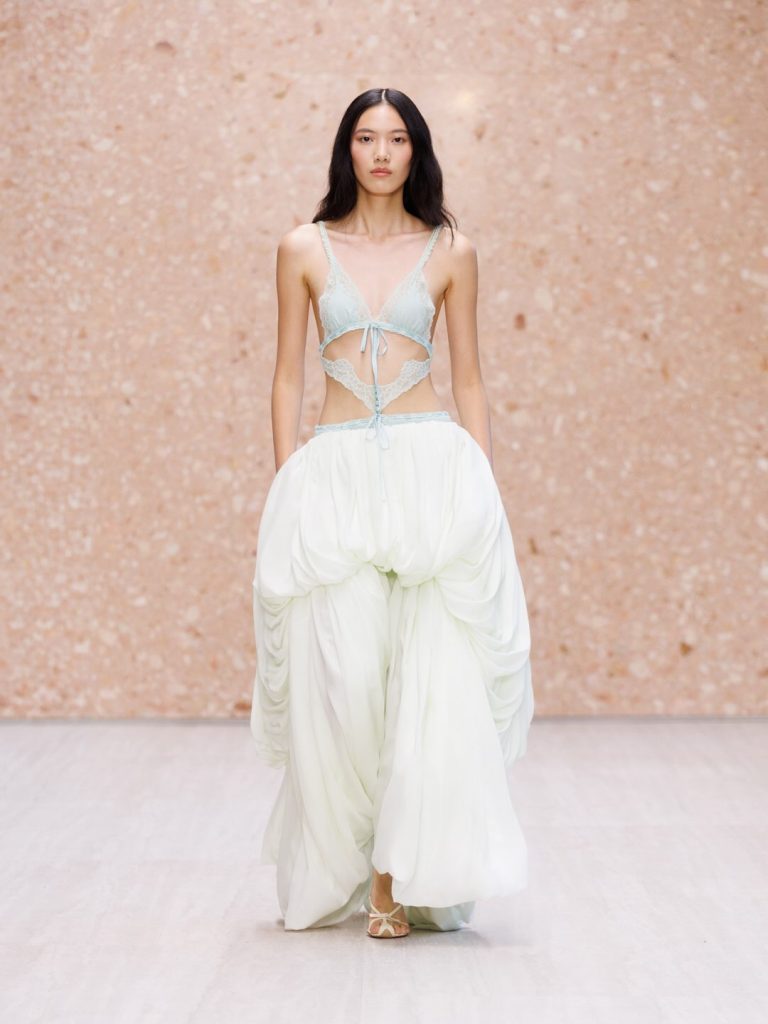 Model in layered champagne silk dress with ethereal movement