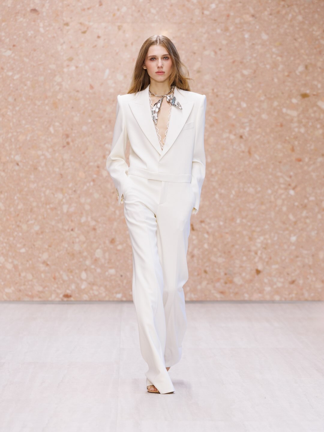 Minimalist linen dress in warm sand tones with subtle texture