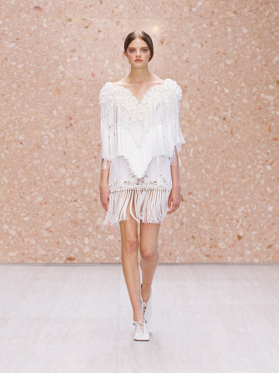 Model wearing flowing champagne silk charmeuse gown from Chloé Summer 2027 collection