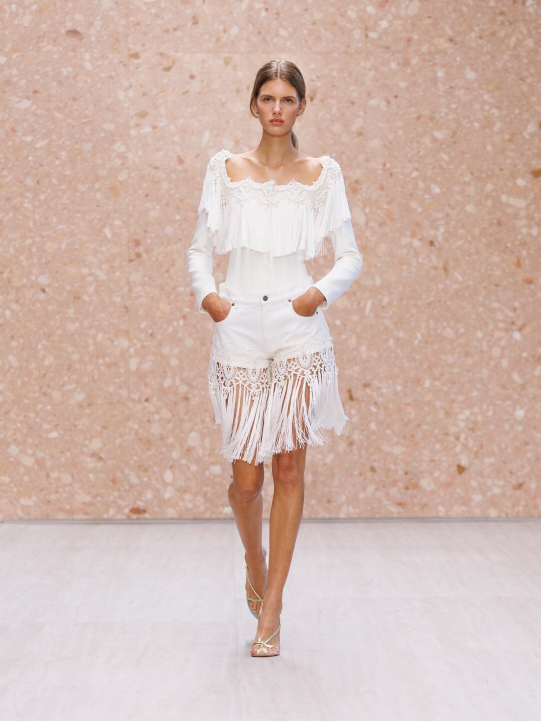 Diaphanous layered garment showcasing interplay between transparent and solid fabrics