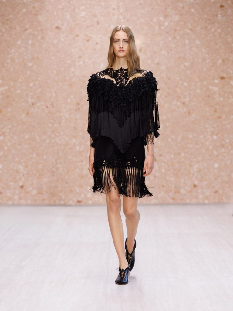 Delicate beaded hemline detail on lightweight summer dress