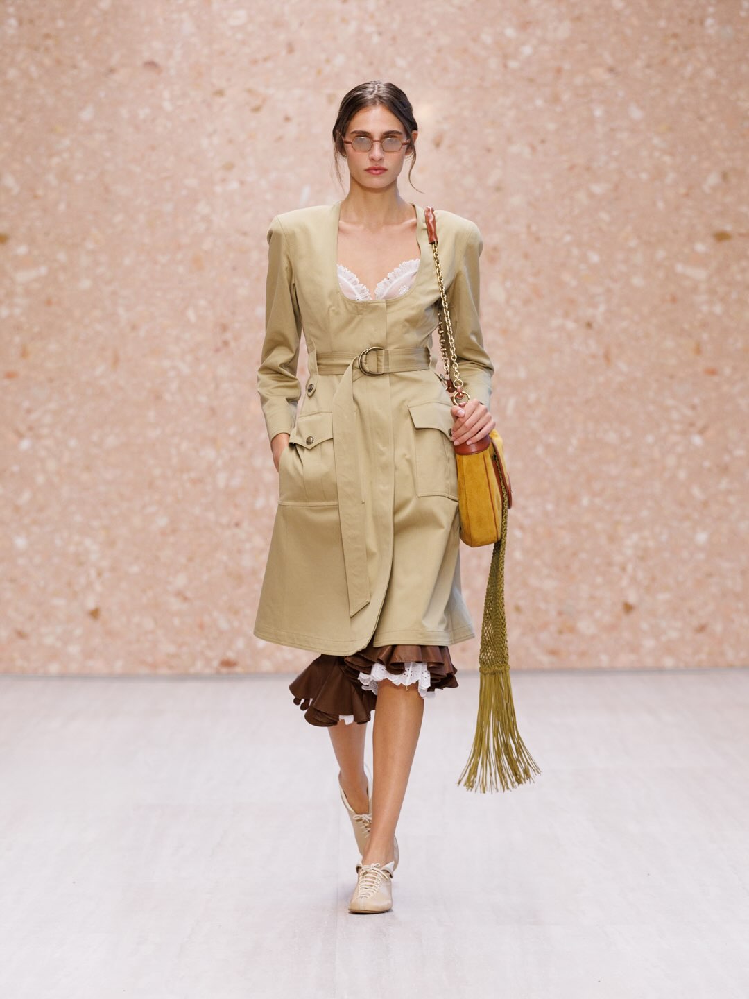 Full-length view of loose tailored trousers with relaxed silhouette