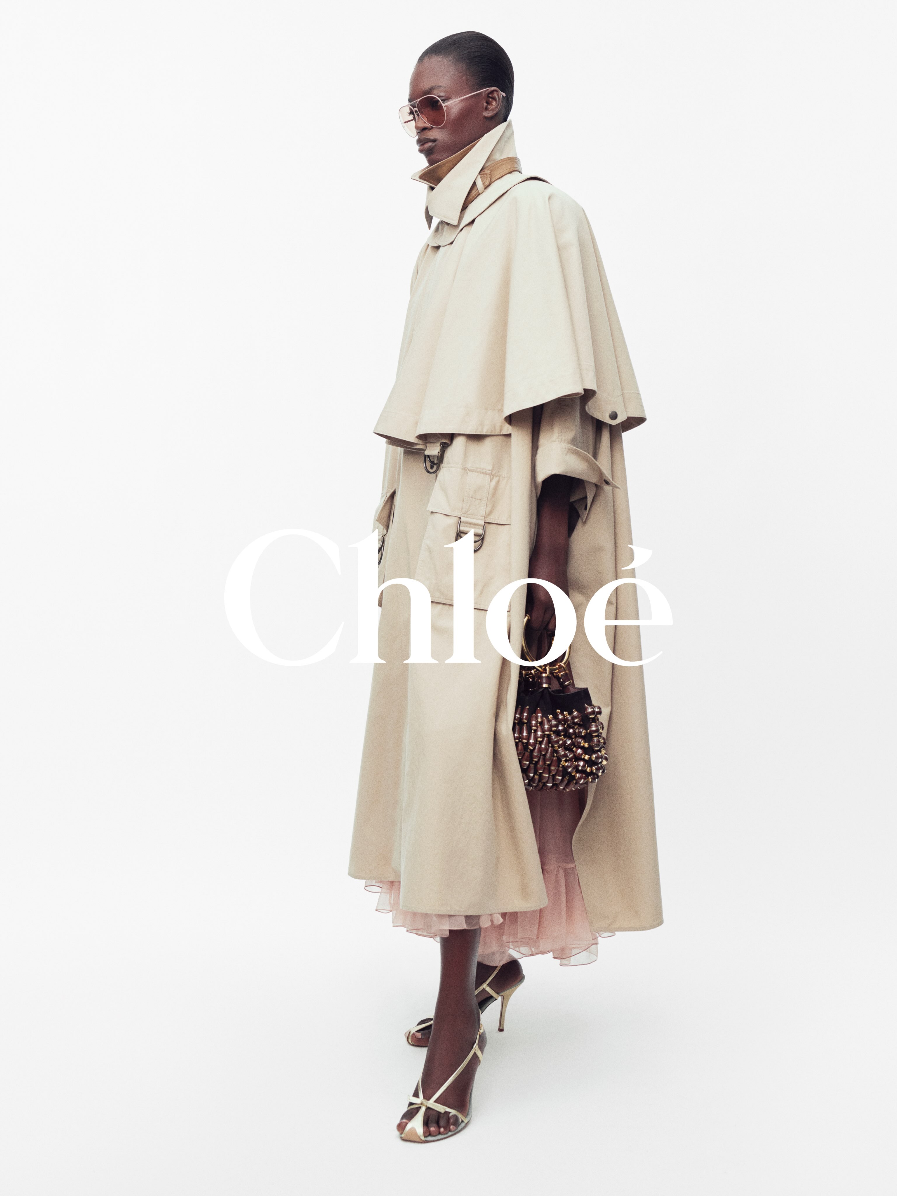 Portrait of Nimota Daudu photographed by Willy Vanderperre for Chloé Summer 27, wearing elegant tailored separates with refined minimalist styling
