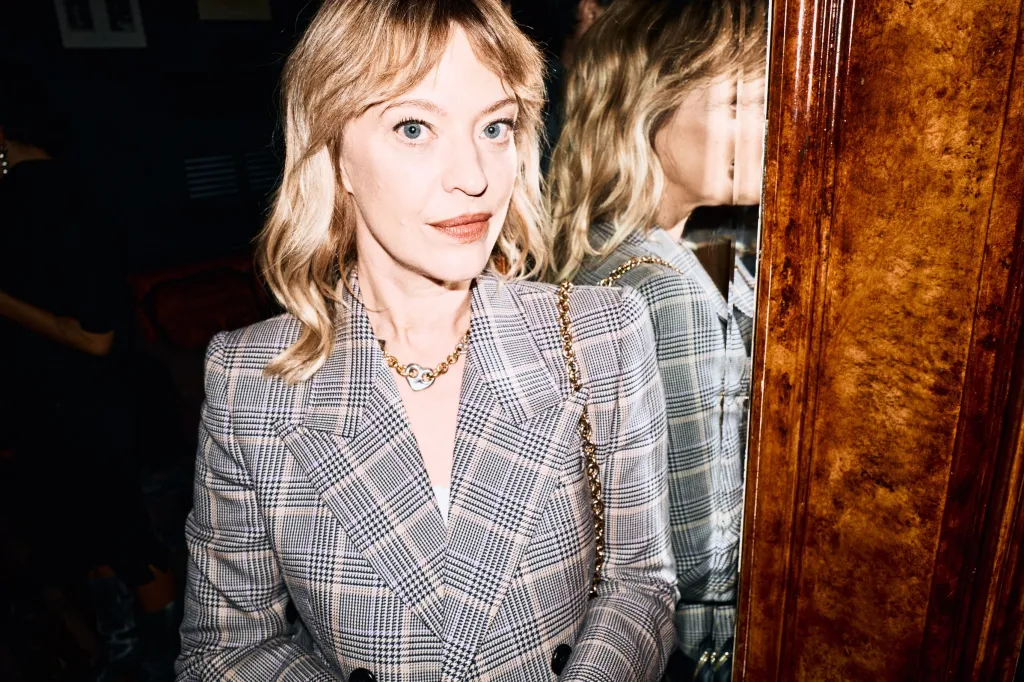 Stylish attendee in neutral tones reflecting the season's palette