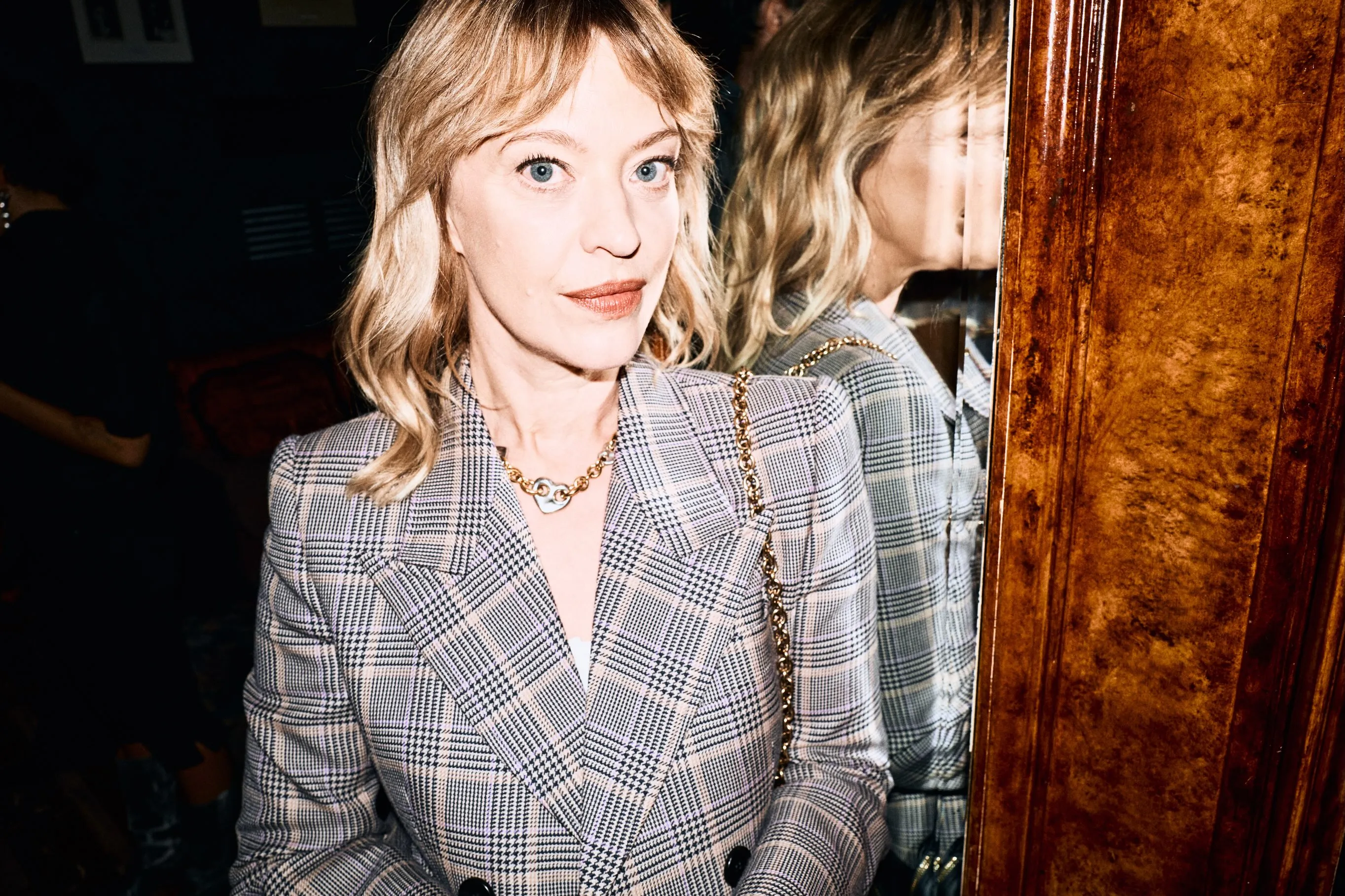 Stylish attendee in neutral tones reflecting the season's palette