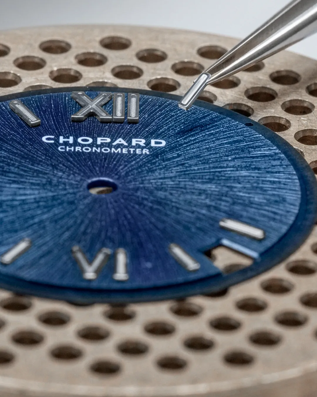The completed Alpine Eagle timepiece displaying the luminous sunburst dial in various lighting conditions